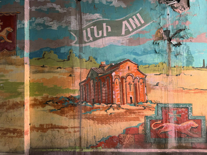 Graffiti entered Armenian urban space in the early 2000s as a protest art against the country’s oppressive political regime. A decade later, the municipality of Yerevan launched a project to decorate the city with politically more neutral, historically oriented graffiti, featuring, among other themes, famous Armenian figures and landmarks. One such work, located on Tumanyan Street in the city center, shows the Ani Cathedral and other ruined churches alongside a lion – the emblem of the Bagratuni dynasty.
