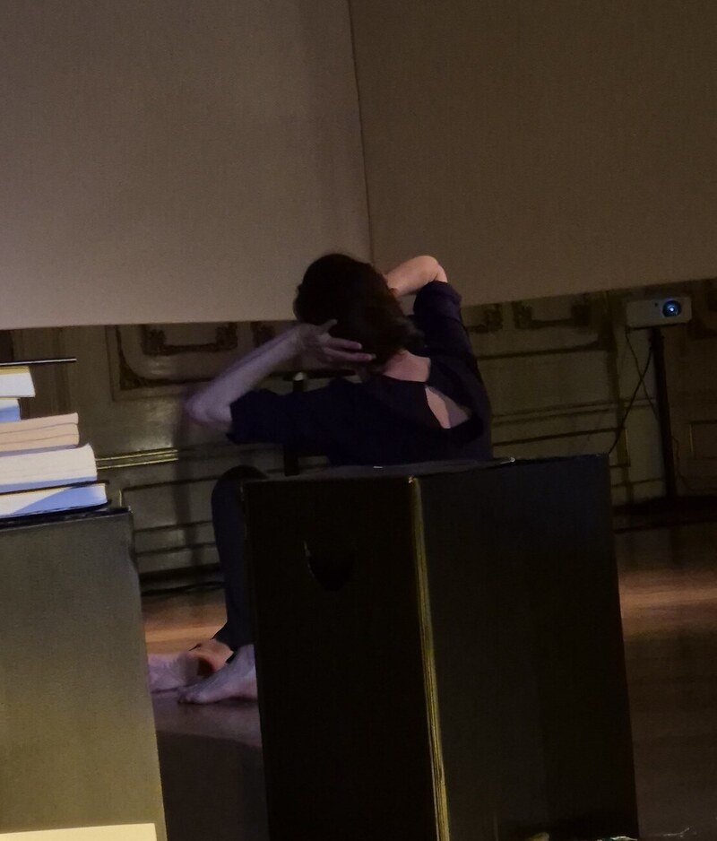 Jasmin İhraç, the Berlin-based artist, choreographer and sociologist, performed <em>Sahman-Grenze-Kuş</em> at the opening of the Ani exhibition at the Petőfi Literary Museum in Budapest on March 19, 2026. Combining choreographed footage recorded at the ruins of Ani with on-site dance performance intertwined with poetry and music from Armenian and Turkish traditions, <em>Sahman-Grenze-Kuş</em> each time opens a singular dialogic space of meditation on the complexities of multiperspectival memory generated by Ani.<br><br>See <a href="https://jasminihrac.net/en/work/Sahman-Grenze-Kus/Text.html">Jasmin İhraç's website</a> for further details.<br><br>The solo dance piece <em>Sahman-Grenze-Kuş</em> deals with my experiences in the ruins of Ani located at the border of Armenia and Turkey. It explores the historical impact of the landscape, referring to themes of border, tradition, traces and the transmission of memory. Through the play with different layers of presence and the combination of live performance with film material, the work intends to establish a dialogue between different media, temporalities and places.<br><br><strong>Idea/Choreography/Dance</strong> Jasmin İhraç<br><strong>Camera</strong> Leyla Cömert, Yusuf Emre Yalçın<br><strong>Editing</strong> Noam Gorbat<br><strong>Sound</strong> Jan Brauer, Matija Vojvodić<br><strong>Music</strong> 'Denge' by Zeynep Gedizlioğlu<br><strong>Piano</strong> Nare Karoyan<br><strong>Artistic Advice</strong> Ayşe Orhon<br><strong>Text</strong> Taniel Varoujan<br><strong>Projection/Lighting</strong> Natalia Sookias, Noam Gorbat, Catalina Fernández, Turan Tayar, Josephine Freiberg<br><strong>Photos</strong> Leyla Cömert, Meike Denker, Jasmin İhraç, Natalia Sookias, Nicolas Beck, Dimitris Alexakis, Silvina Der-Meguerditchian, Josephine Freiberg, Kadir Yeniaras, Ute Langkafel Maifoto, Nar Photos<br><strong>Premiere</strong> Dusseldorf, 3rd November, 2017, Galerie Kunst und Denker Contemporary<br><br>With the support of Kunststiftung NRW and Goethe Institute.<br>Part of the research for this production was developed in 2017 in the frame of the project "Unacknowledged Loss" directed by Barbara Raes a project of HAU Hebbel am Ufer. Supported in the frame of Bündnis internationaler Produktionshäuser von der Beauftragten der Bundesregierung für Kultur und Medien.<br><br>With special thanks to Ricardo Carmona, Nevzat İhraç, Julien Devaux, Nigol Bezjian, Erhan Arık, Krikor Moskofian and Quin Manassian<br><br><strong>Performances</strong><br><strong>Premiere:</strong> Dusseldorf, Galerie Kunst und Denker Contemporary, November, 3, 2017<br>Athens, Polychoros KET, November, 28-29 2017<br>Marseille, La Zouze-Christophe Haleb (Festival DANSEM), Dezember, 14-15, 2017<br>Ankara, Goethe Institut, December, 19, 2017<br>Berlin, Uferstudios, February, 24, 2018<br>Berlin, Gorki Theater, April, 21, 2018<br>Istanbul, Kulturakademie Tarabya, June, 30, 2018<br>Marrakesh, ESAV, Festival On Marche, March, 14, 2019<br>Berlin, Bethanien, Studio 1, Studio Bosporus, October, 15, 2021<br>Berlin, Bethanien, Genatz - A Performative Dinner, Silvina Der-Meguerditchian, March, 27, 2025<br>Berlin, Gorki, Genatz - A Performative Dinner, Silvinia Der-Meguerditchian, April, 23, 2025<br>Budapest, Petőfi Literary Museum, March, 19, 2026<br>Berlin, Haus der Kulturen der Welt, HKW, April, 26, 2026