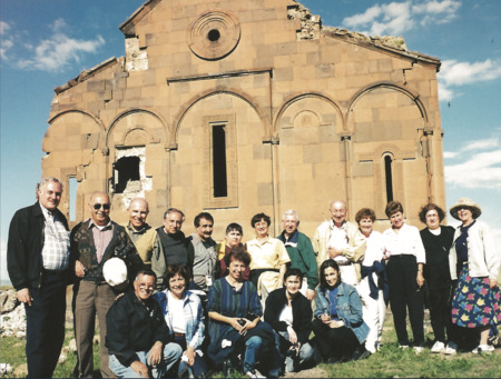 Armen Aroyan, on the left, with a group of visitors before the Ani Cathedral, 2000, The Pilgrim Speaks, Volume 1, p. 441. Courtesy of the USC Dornsife Institute of Armenian Studies, University of Southern California – Armen Aroyan Collection.